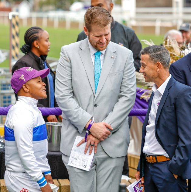 Hollywoodbets’ Devin Heffer is flanked by winning rider Muzi Yeni and Anthony Delpech