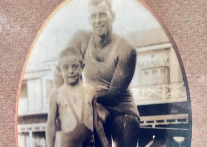 Frank O’Neill as a five-year-old boy with famous Olympic champion Andrew “Boy” Charlton pictured at Manly Baths in 1932 (Pic - Frank O’Neill Family Collection)