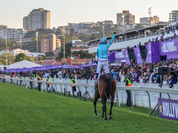 Oriental Charm and JP van der Merwe enjoy their victory canter