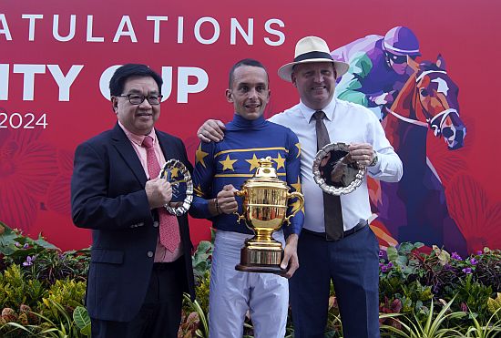 The all-too-familiar trio celebrates Lim's Kosciuszko's win onstage - (from left) owner Mr Lim Siah Mong, jockey Marc Lerner and trainer Daniel Meagher