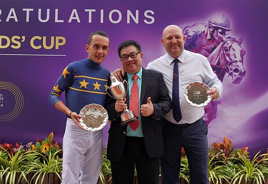 The winning trio - (from left) jockey Marc Lerner, owner Mr Lim Siah Mong and trainer Daniel Meagher