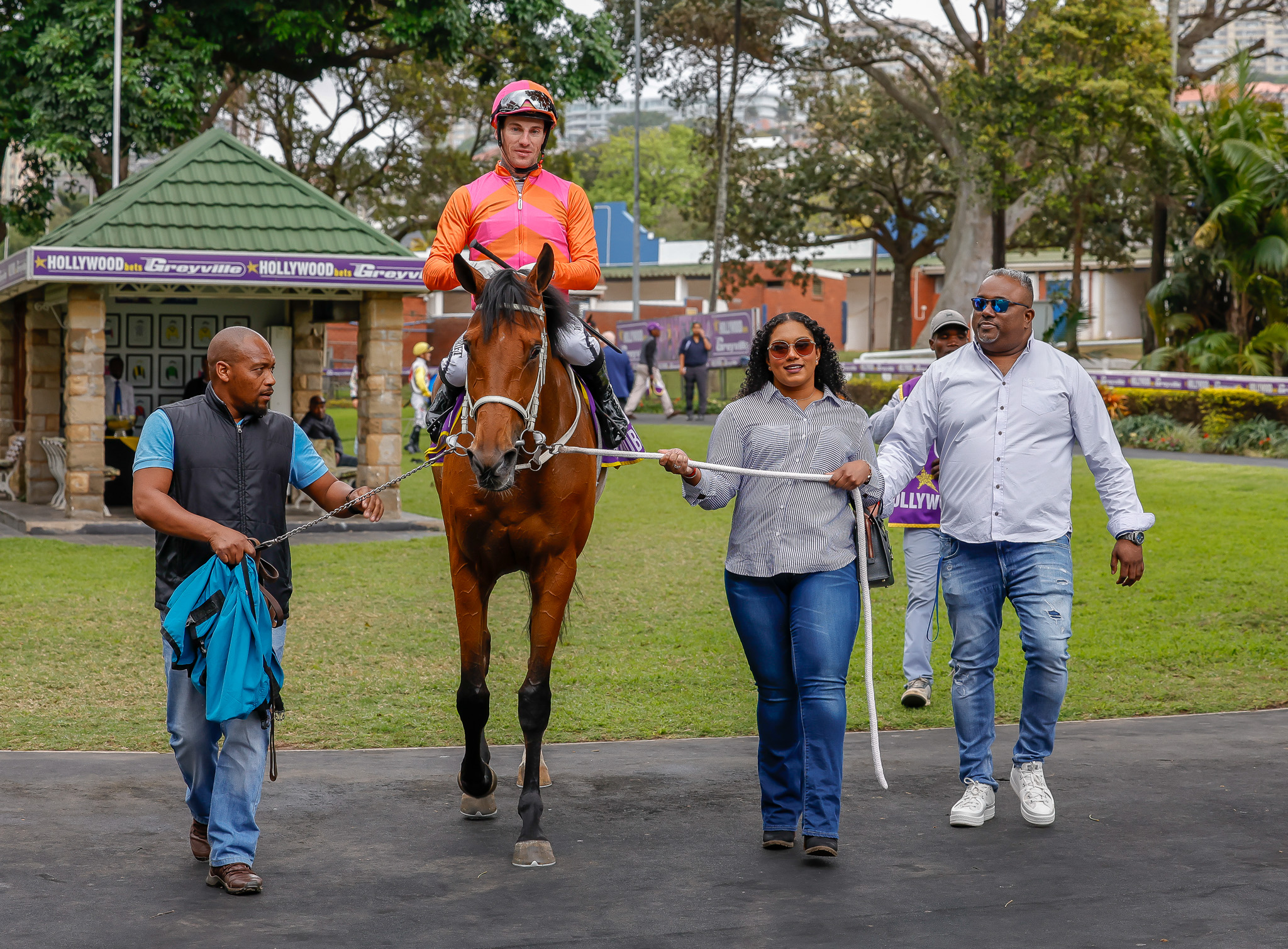 Queen Amina (Craig Zackey) is led in by Kundanika and Preggie Somasundram, with the assistance of the Robbie Hill team (Pic - Candiese Lenferna)