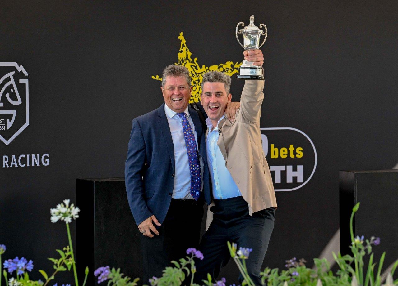 Championship elation! Trainer Brett Crawford and part-owner Craig Kieswetter celebrate a big victory (Pic - Chase Liebenberg)