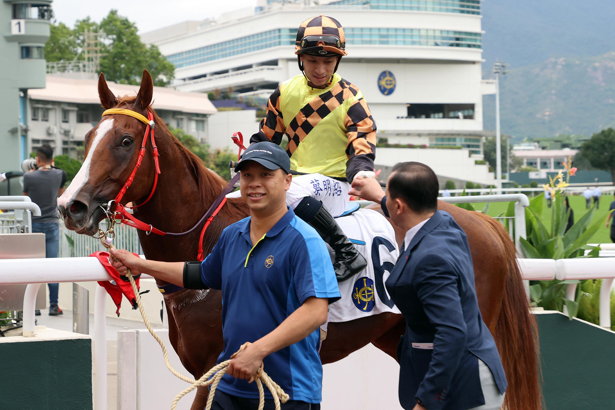 Cody Mo celebrates with Matthew Chadwick after Magic Control’s win (Pic - HKJC)