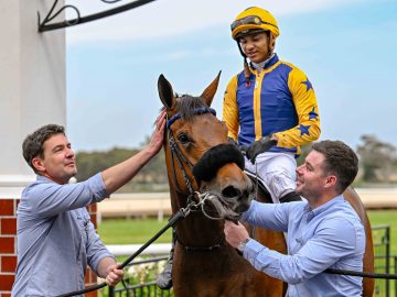 Gulf Racing Club stalwart Petrus du Toit and trainer Adam Marcus lead Hampstead Heath (Grant van Niekerk) in after her smart win yesterday (Pic - Chase Liebenberg)