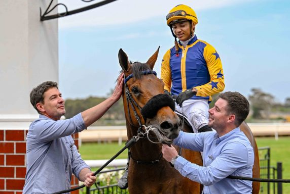 Gulf Racing Club stalwart Petrus du Toit and trainer Adam Marcus lead Hampstead Heath (Grant van Niekerk) in after her smart win yesterday (Pic - Chase Liebenberg)