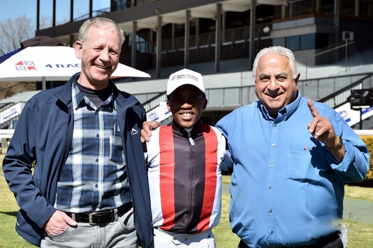 Willem Ackerman is seen with Philasande Mxoli. and trainer Tryrone Zackey on this post-race file image (Pic - JC Photos)