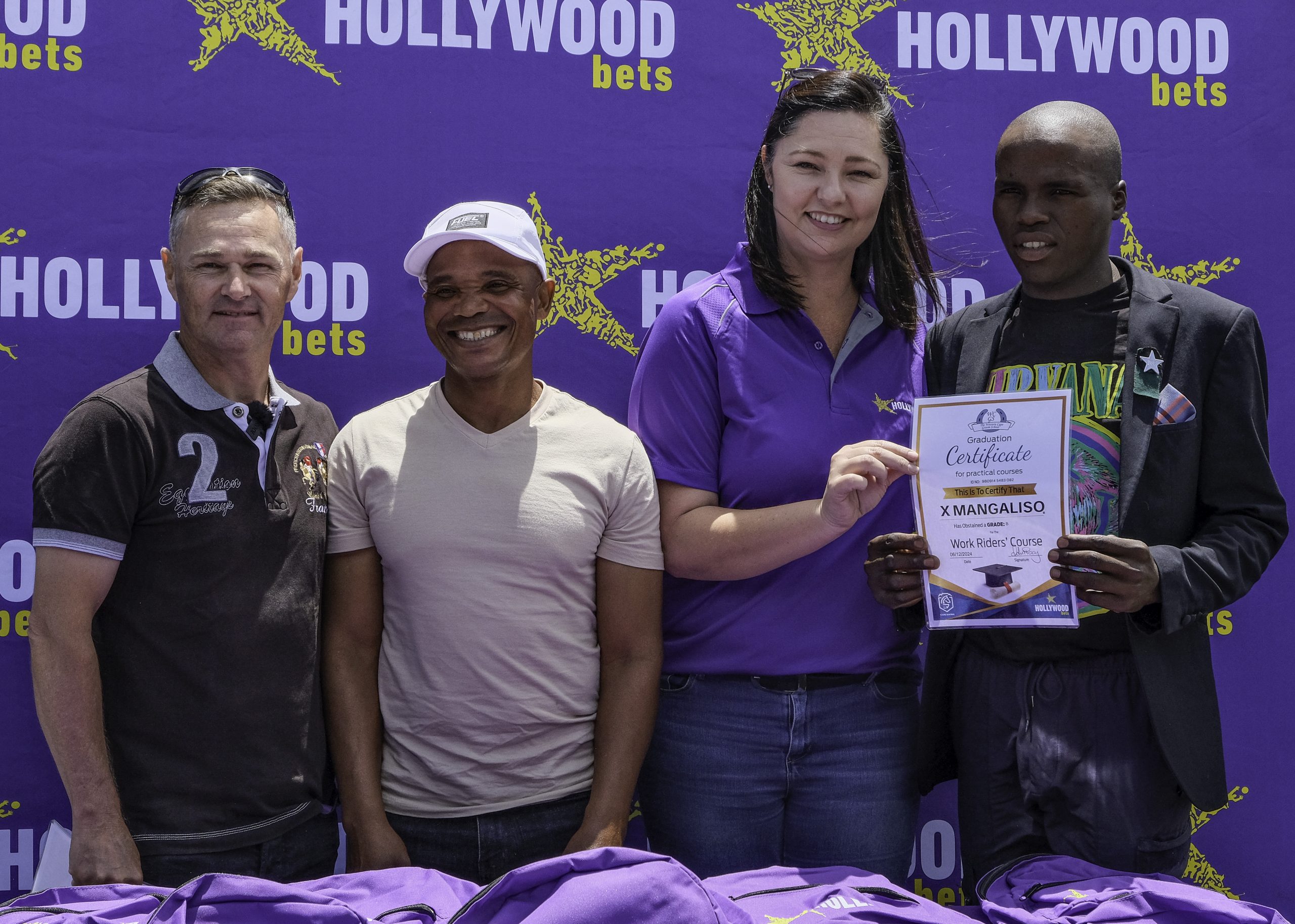 Riding Master Craig Du Plooy, Workrider Of The Year William Bambiso, Hollywoodbets’ Tania Van Eck and proud recipient Xumani Mangaliso at the ceremony on Friday morning (Pic - Lily Jamieson)