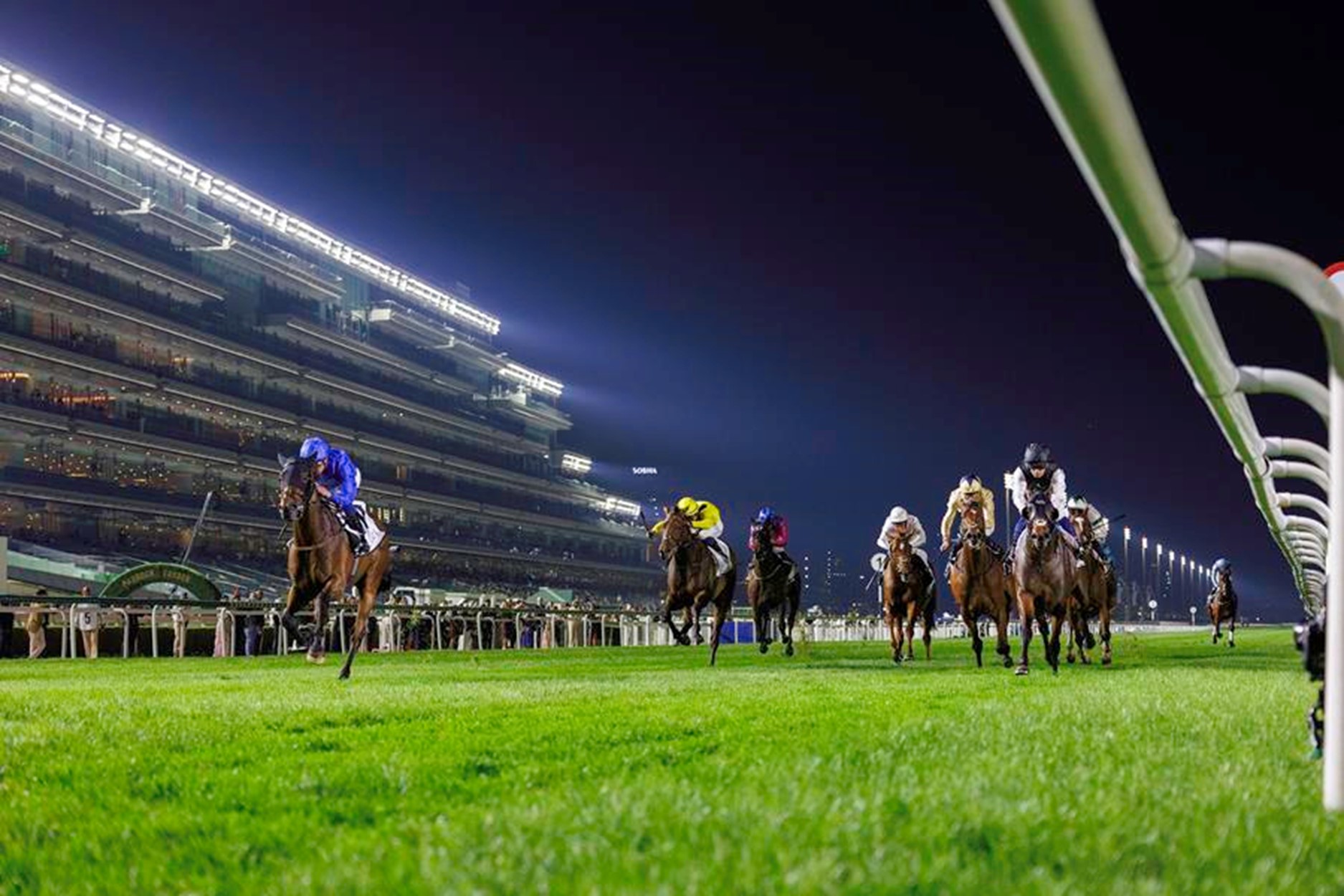 Conquest (William Buick in blue) wins the Gr3 Dubai Millenium Stakes on Friday evening (Pic - DRC)