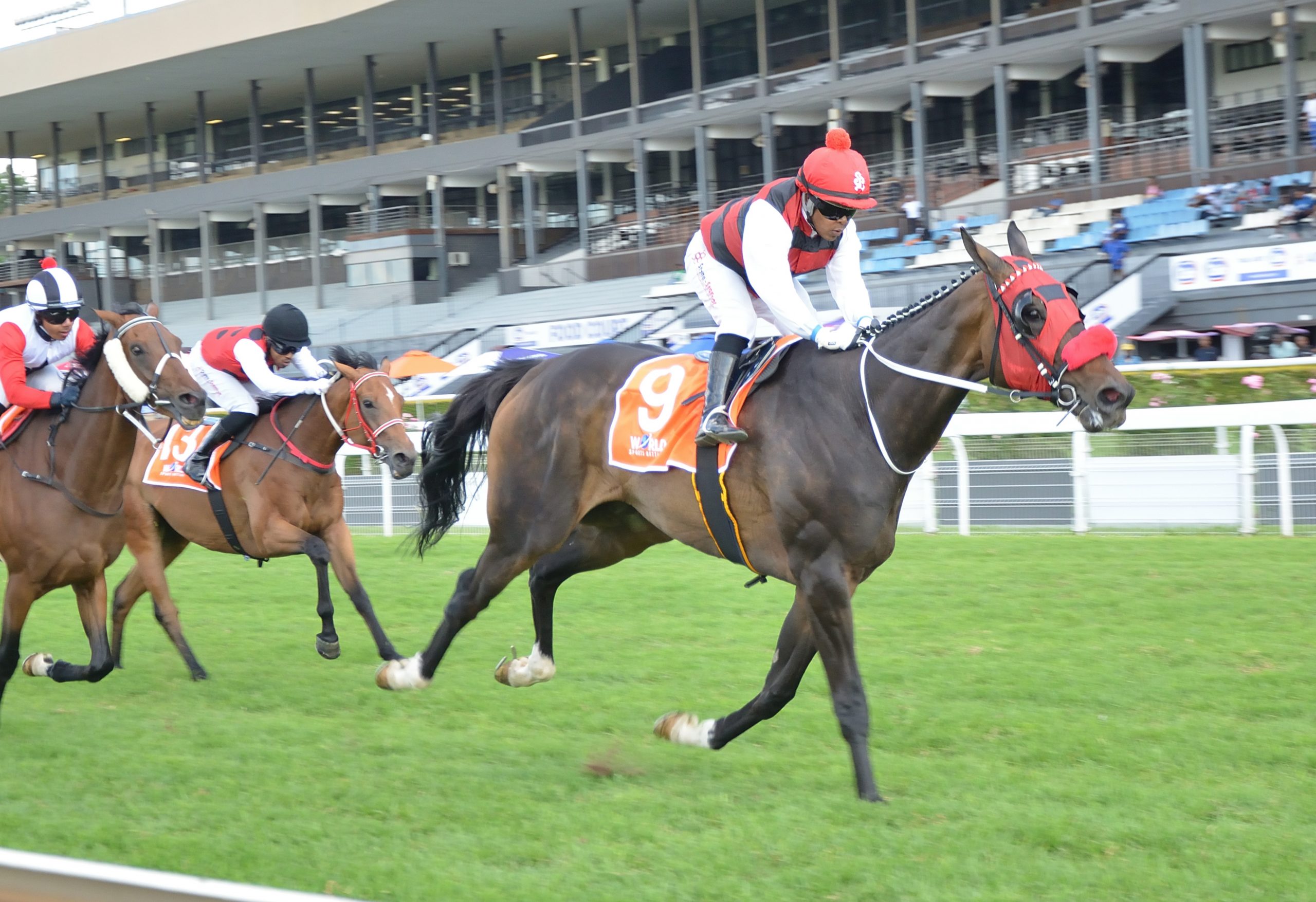 Breeze Over stays on powerfully under Muzi Yeni as Nathan Klink keeps Marauding Horde at his task, with Twenty Drachma’s (Philasande Mxoli) plugging on for third (Pic - JC Photos)