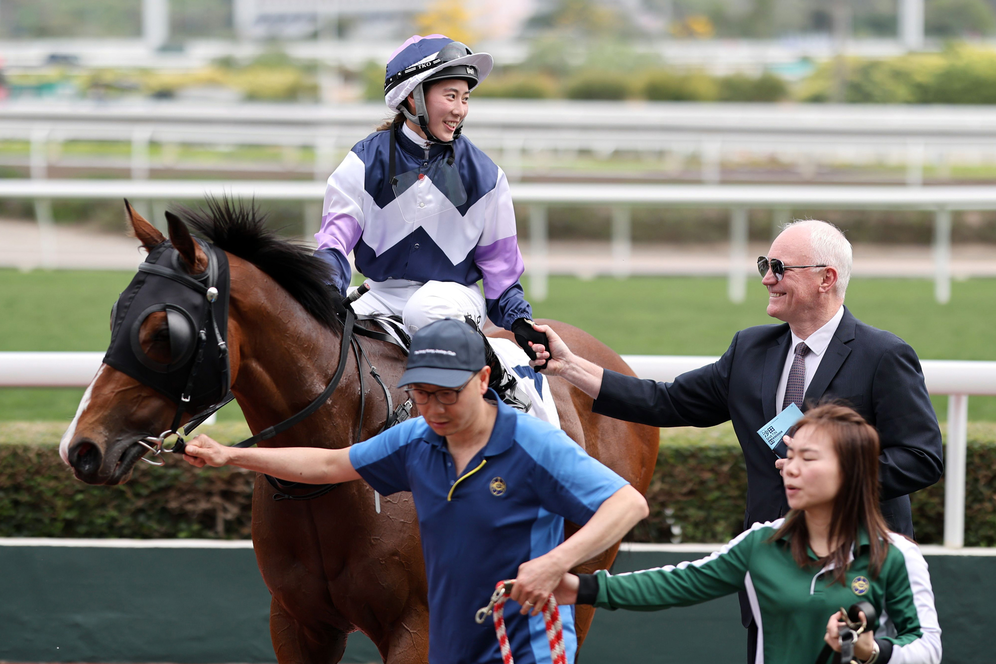 Britney Wong celebrates victory atop Natural High with David Hall (Pic - HKJC)