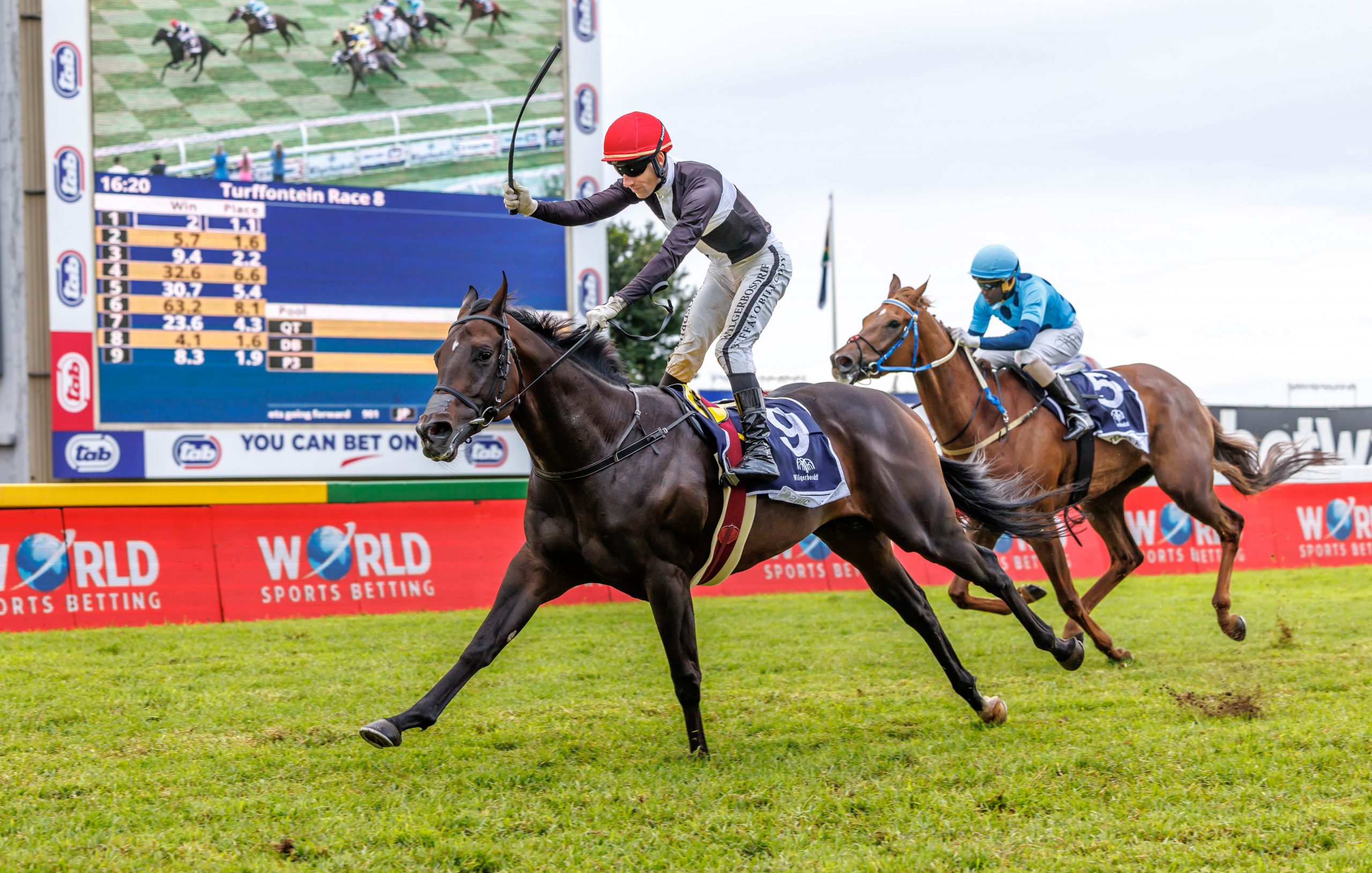 Cosmic Speed (Craig Zackey) stays on well to beat Texas Red (Kabelo Matsunyane) in a slow-run race (Pic - Candiese Lenferna)